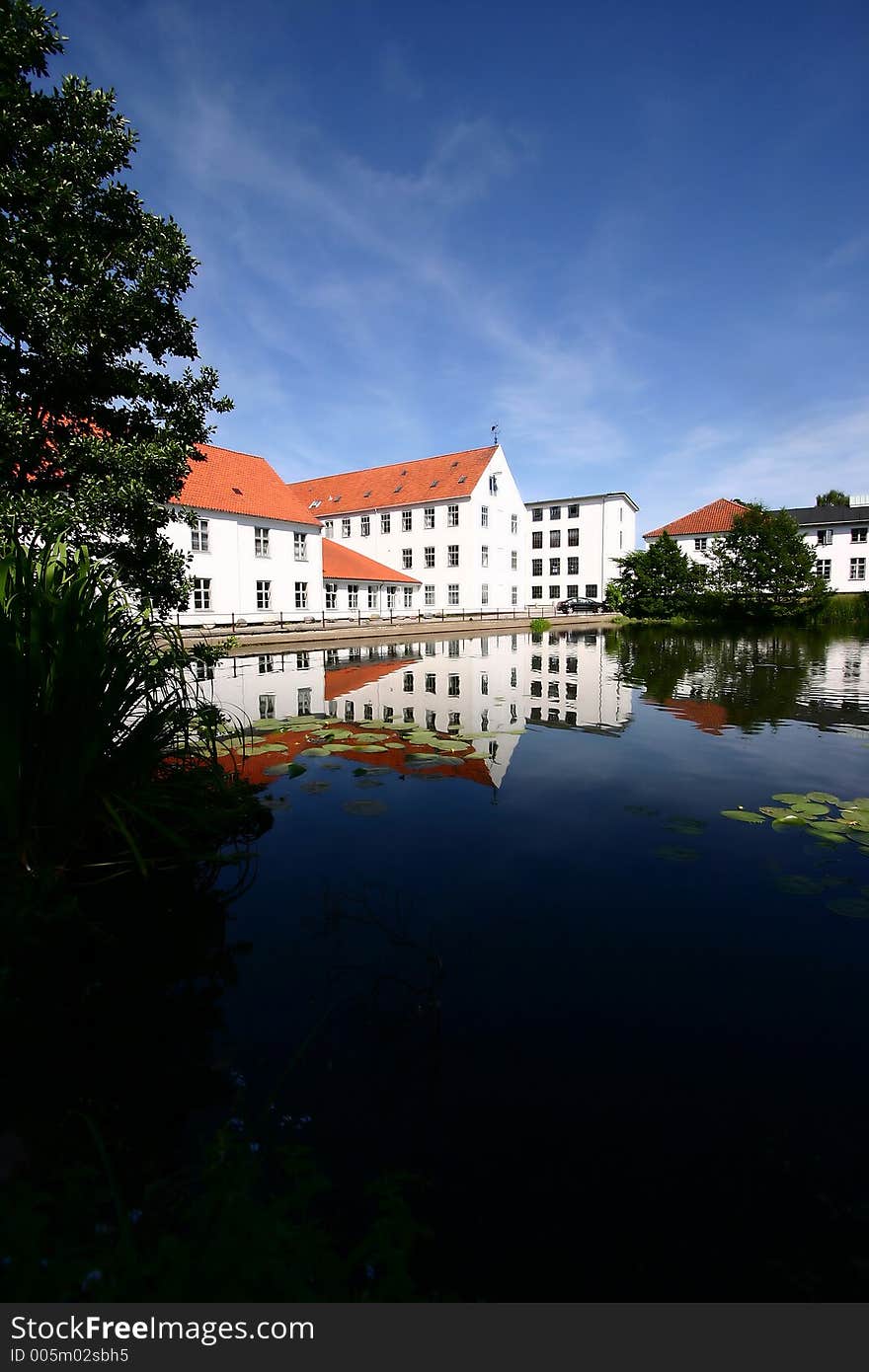 Reflexion of a traditional building built in front of a lake in denmark. Reflexion of a traditional building built in front of a lake in denmark