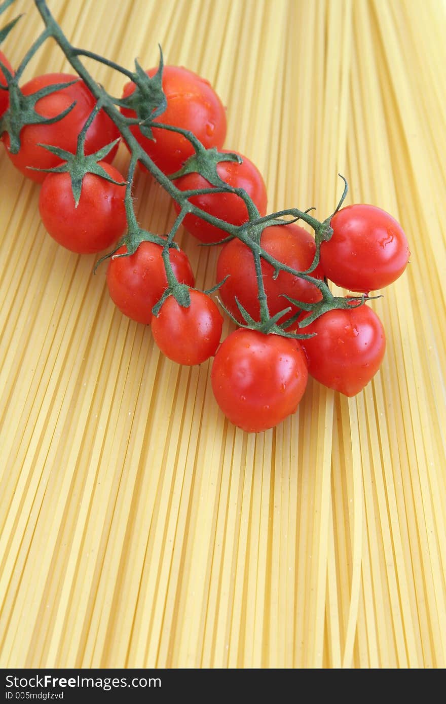 Tomatoes with raw spaghetti