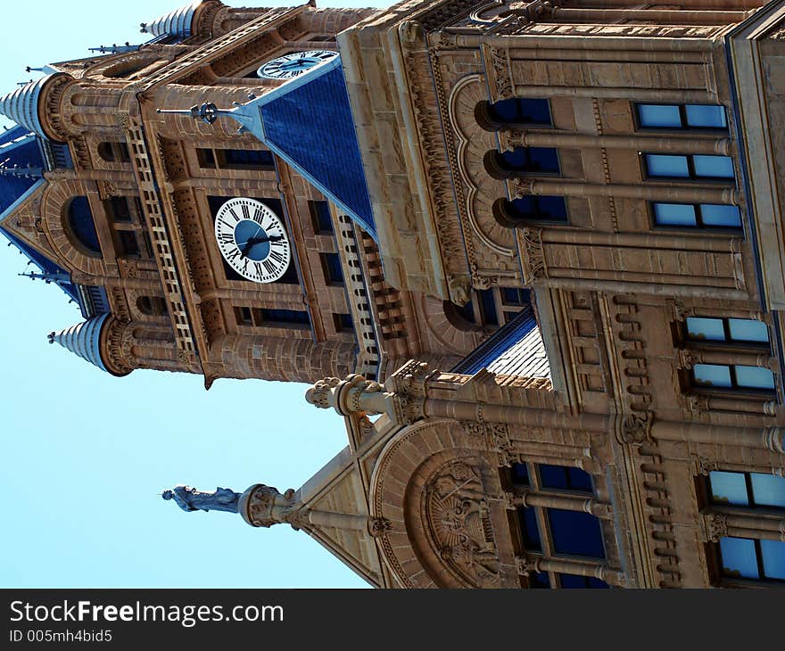 Sandstone building windows and clock tower