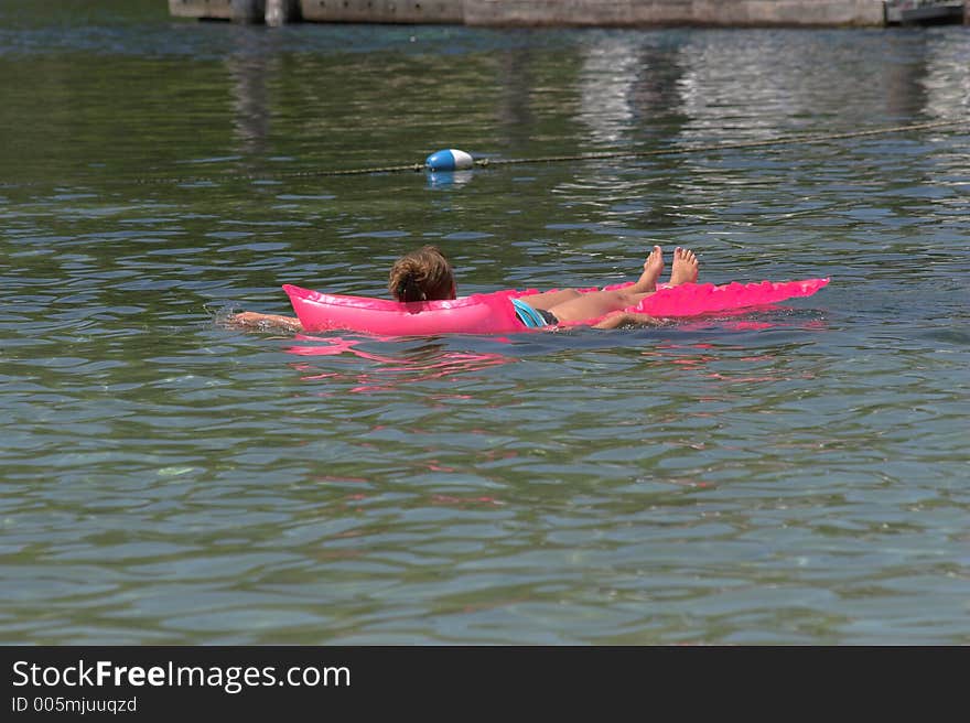 Woman swimming & playing at local lake in Florida. Woman swimming & playing at local lake in Florida