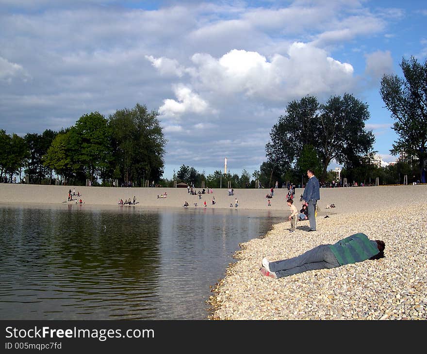 Man sleeping on the beach in the late afternoon. Man sleeping on the beach in the late afternoon