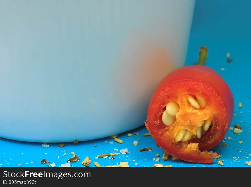 Cup and chilli with spices around