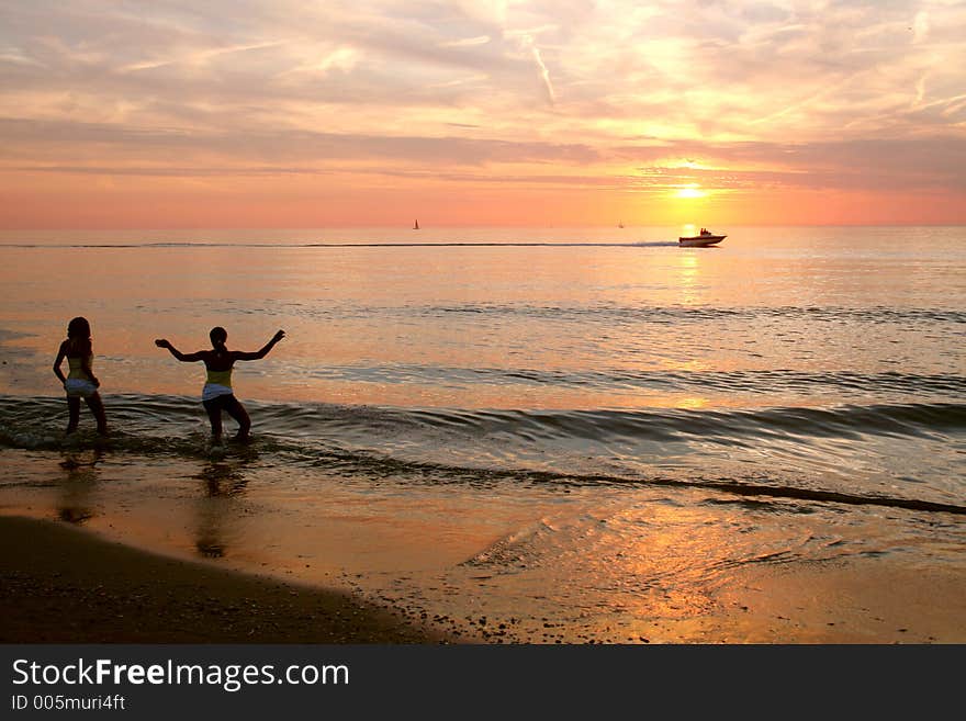 Girls exiting by colored sunset. Girls exiting by colored sunset