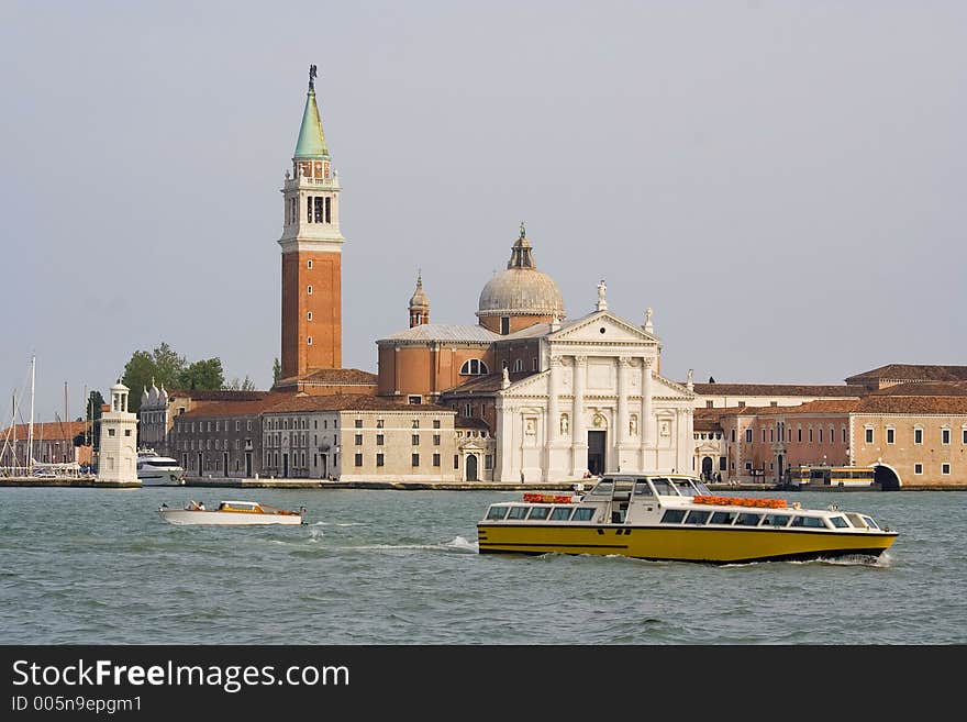 A Public boat in Venice. A Boat stop visible as background