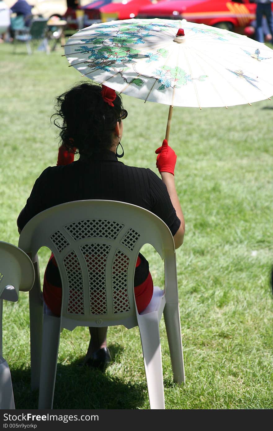 Woman Sitting with Parasol