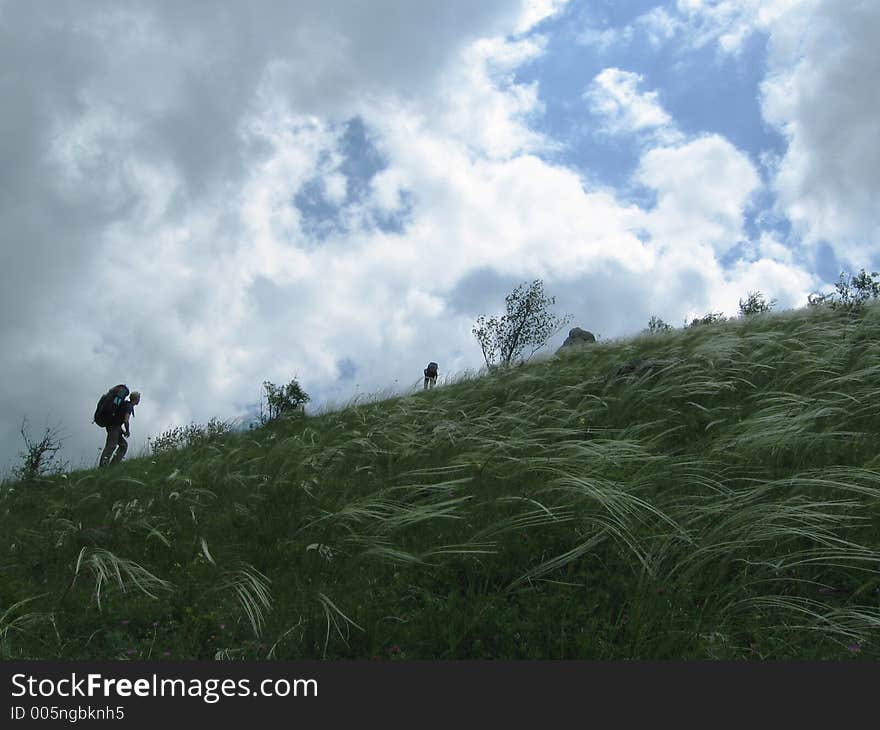 Two people on the green hill. Two people on the green hill