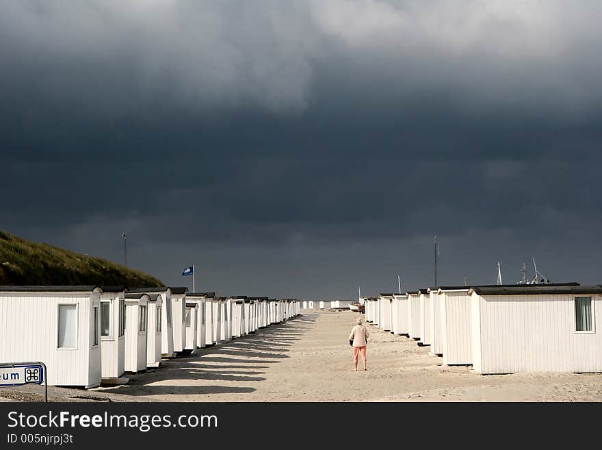 Summer in denmark:beach of loekken, beach houses in line