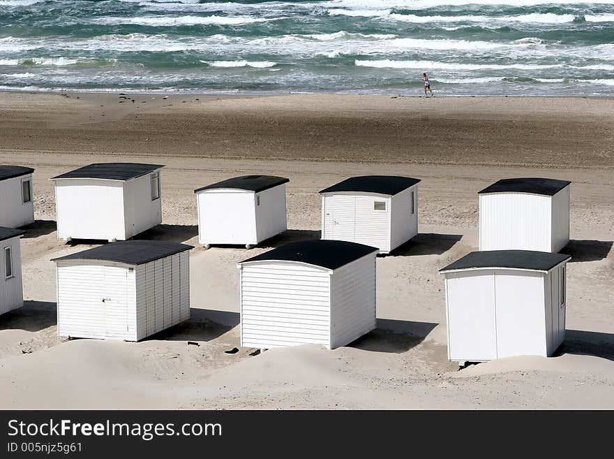 Summer in denmark:beach of loekken, beach houses in line