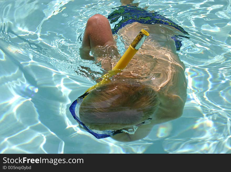 Boy snorkeling under water. Boy snorkeling under water