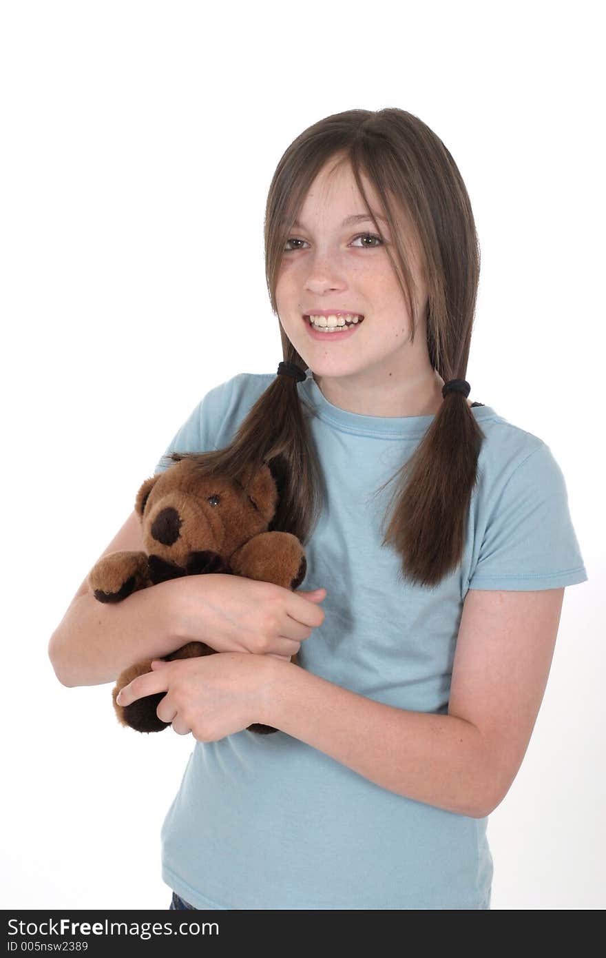 Little girl with big smile, holding a teddy bear. Shot on white. Little girl with big smile, holding a teddy bear. Shot on white.