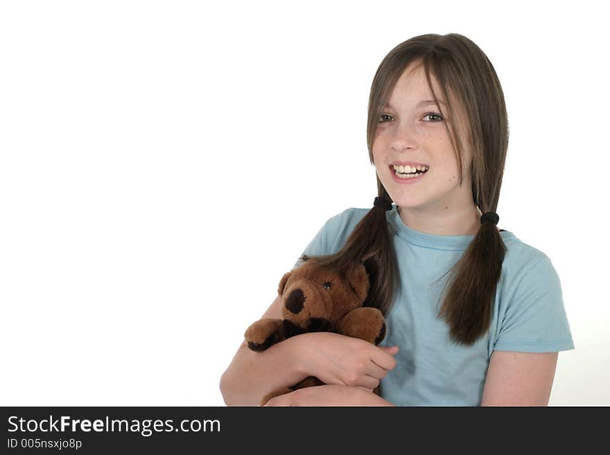 Little girl with big smile, holding a teddy bear. Shot on white. Little girl with big smile, holding a teddy bear. Shot on white.