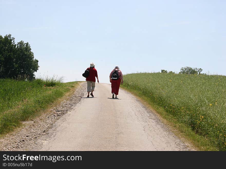 Two women on the trip on a sunny summer  day. Two women on the trip on a sunny summer  day