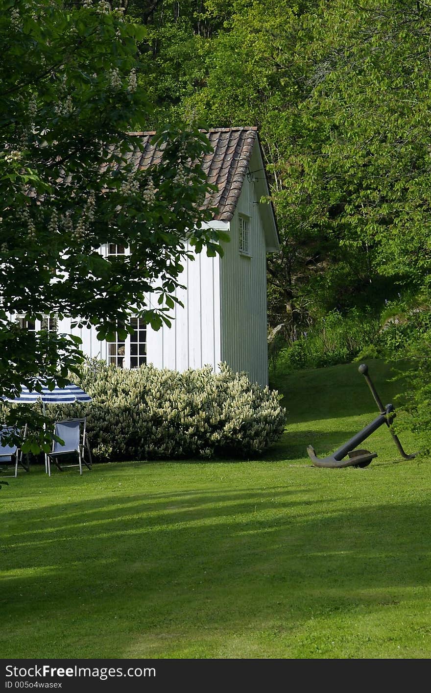 Detail of old, white, wooden house in Norway