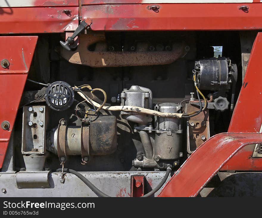 View at the engine of an old tractor. View at the engine of an old tractor