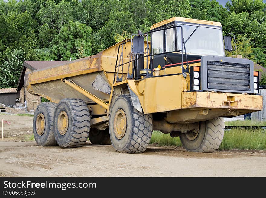 Large dump truck - earthmover on a construction site. Large dump truck - earthmover on a construction site.