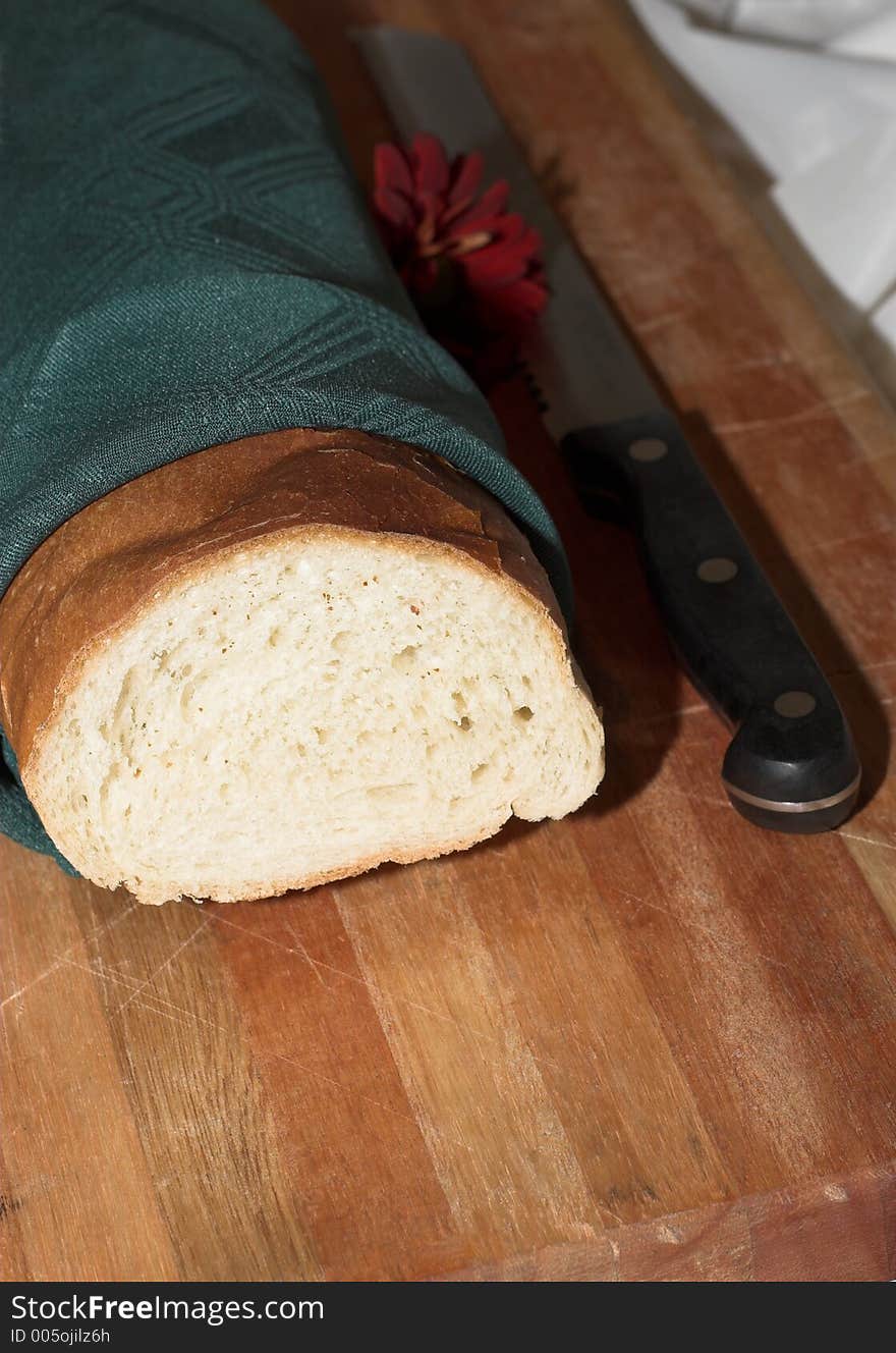 Bread in napkin with knife. Bread in napkin with knife