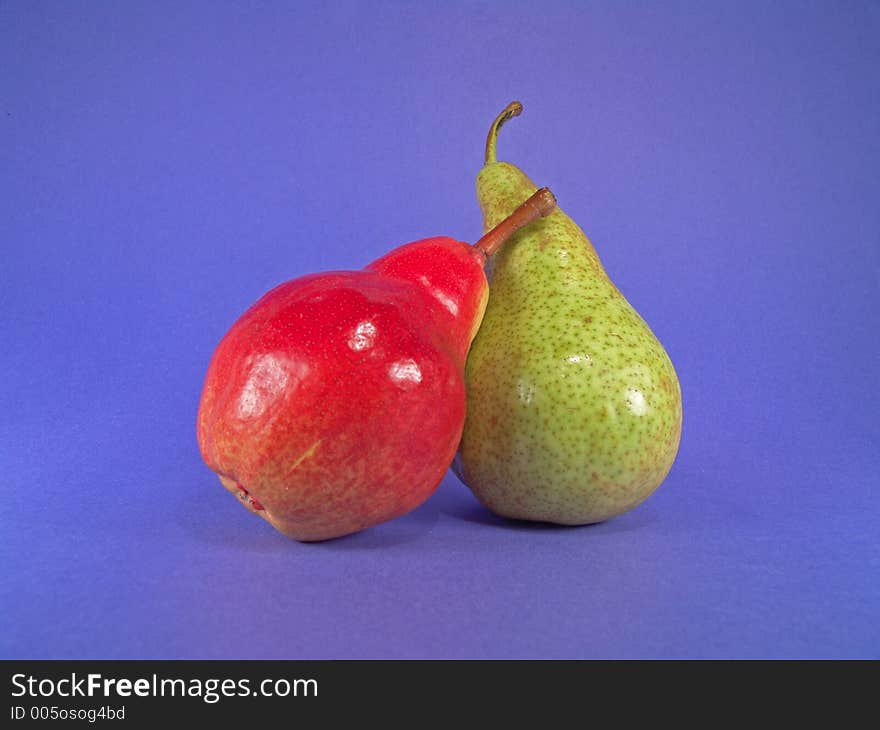 A red and a green European pears.