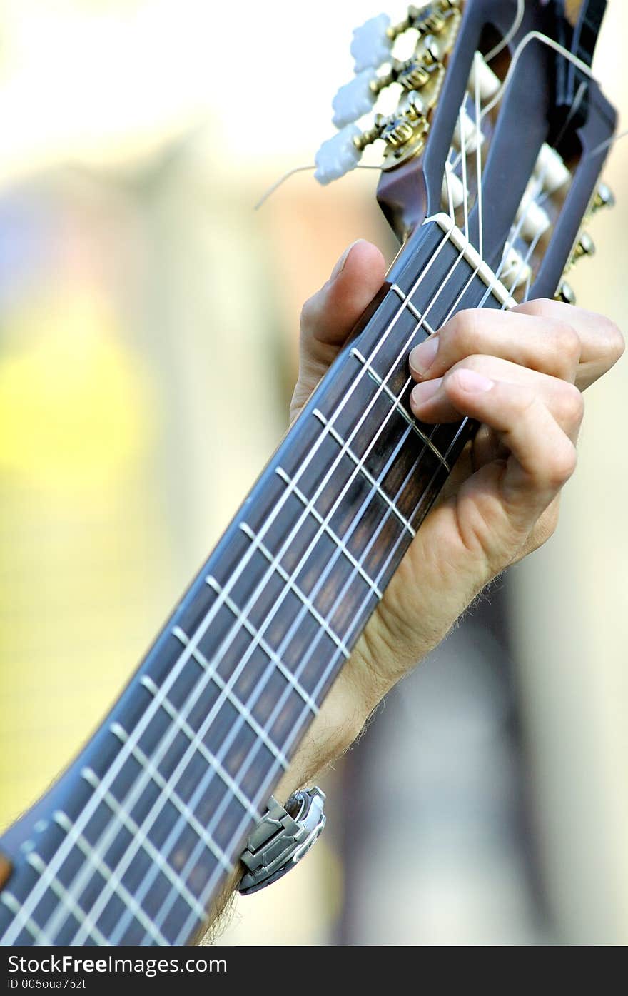 Playing a guitar. Playing a guitar