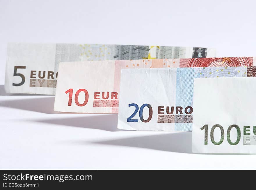 Folded papermoney on white background. Folded papermoney on white background