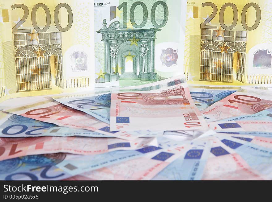 A circle made of european papermoney with big notes in the background. A circle made of european papermoney with big notes in the background