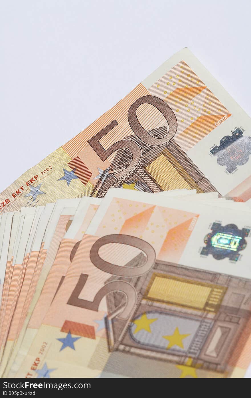 A pile of european papermoney on white background. A pile of european papermoney on white background