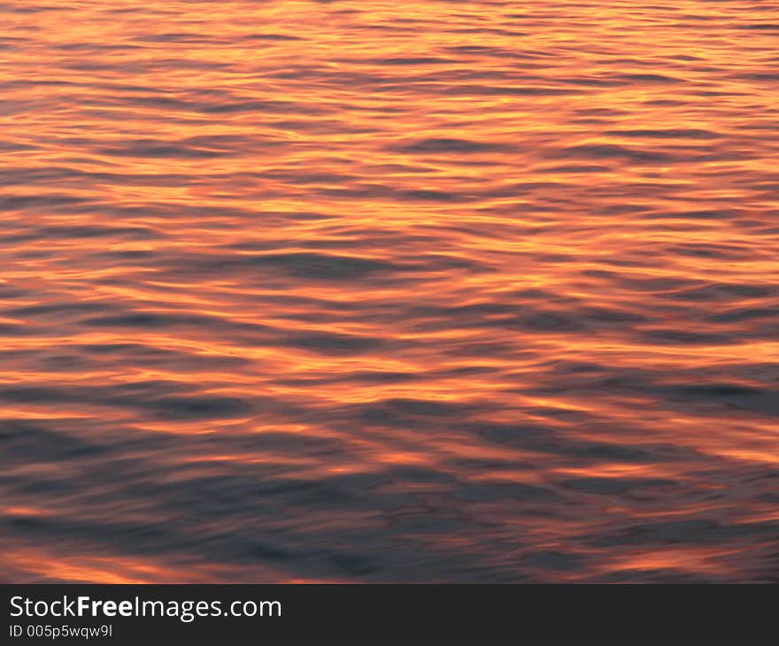 The reflection of the sun on the water gives an excellent background or texture. The reflection of the sun on the water gives an excellent background or texture