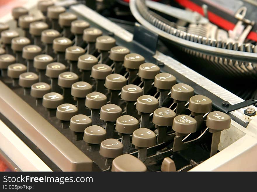 A vintage portable typewriter with ink ribbon