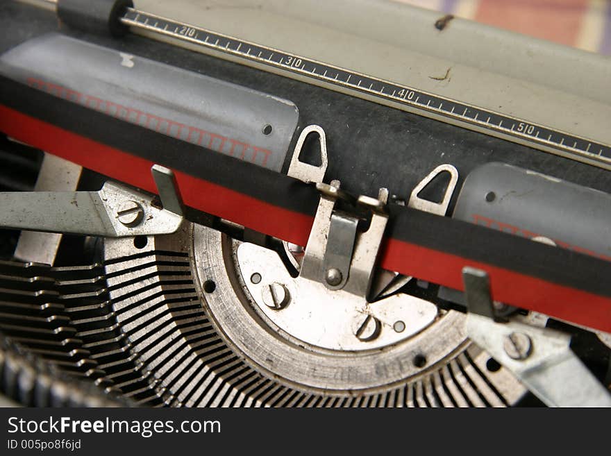 A vintage portable typewriter with ink ribbon