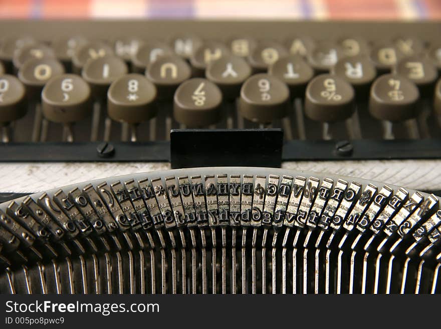 A vintage portable typewriter with ink ribbon