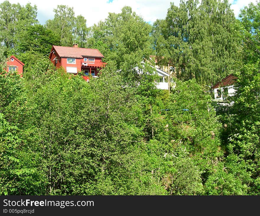 Red house in the forest. Red house in the forest.