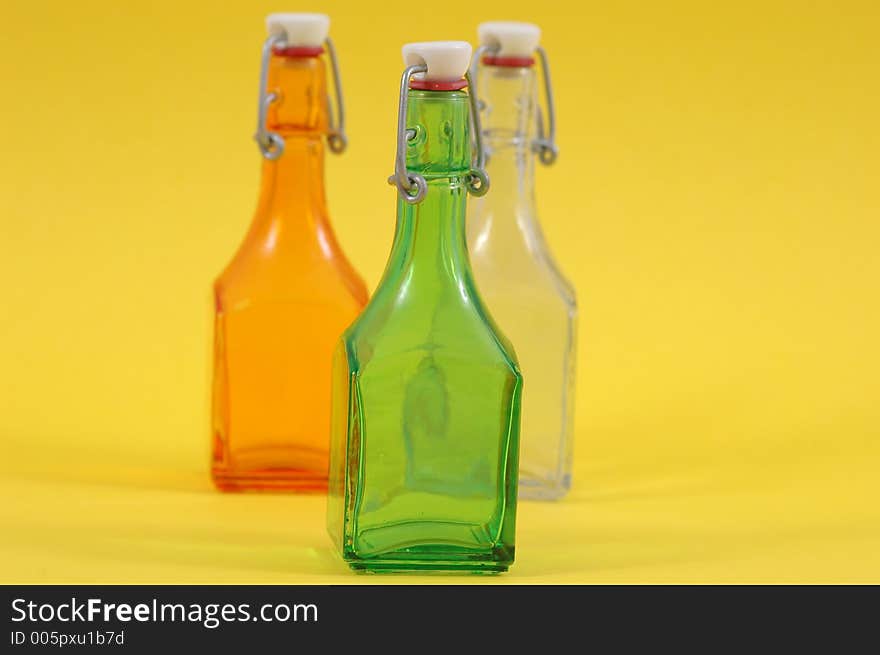 Three shiny bottles