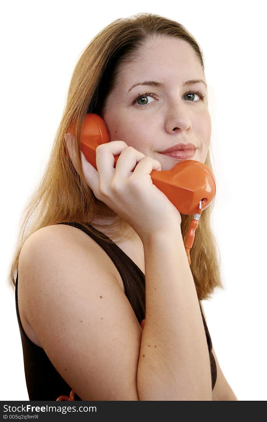 Woman listening and smiling on the phone. Woman listening and smiling on the phone