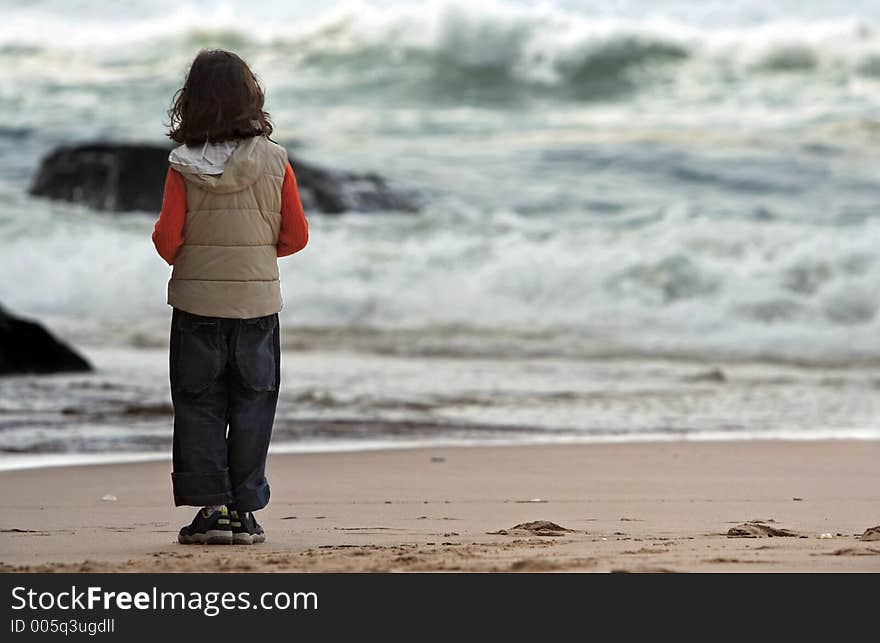 Girl looking at the view at the beach. Girl looking at the view at the beach