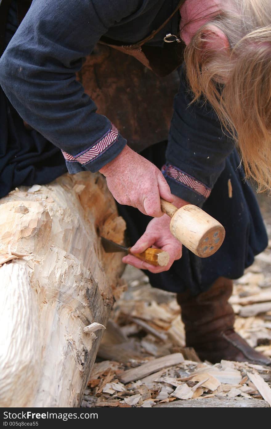 A craftsman working wood the oldfashioned way,. A craftsman working wood the oldfashioned way,