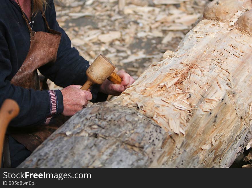 A craftsman working wood the oldfashioned way,. A craftsman working wood the oldfashioned way,