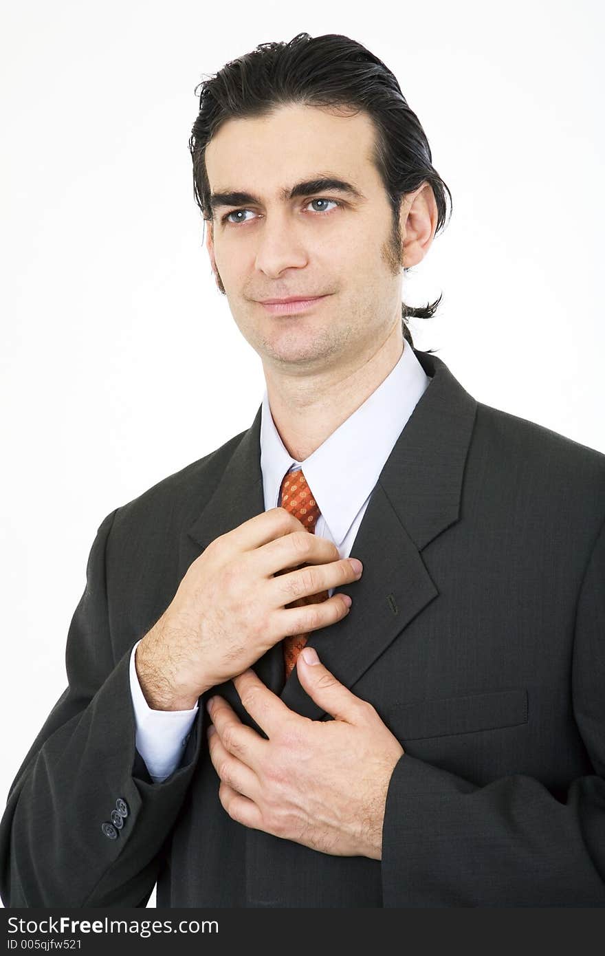 Businessman fixing his tie. Businessman fixing his tie