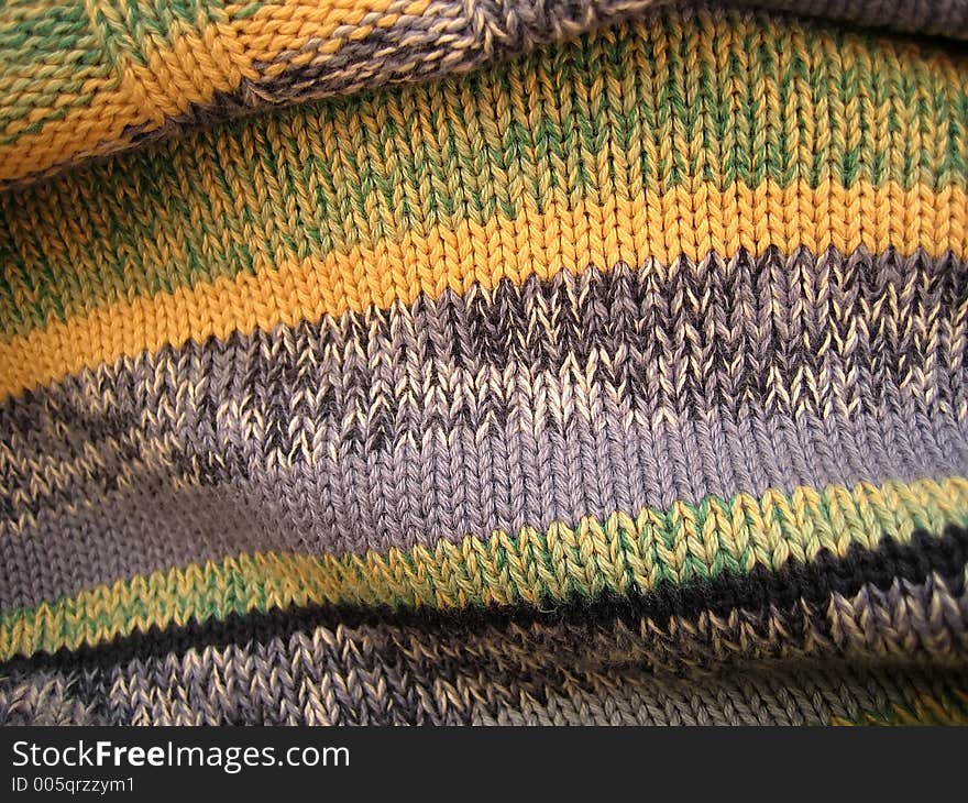 Woolen sweater from the threads of different colors.