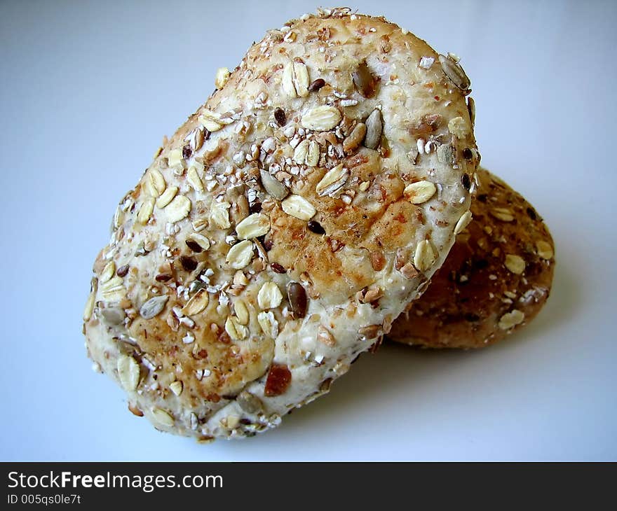 Bread with grain on blue background.