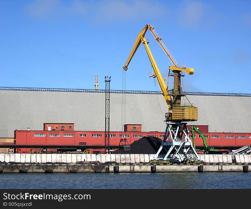 Lifting cranes in the port. Lifting cranes in the port.