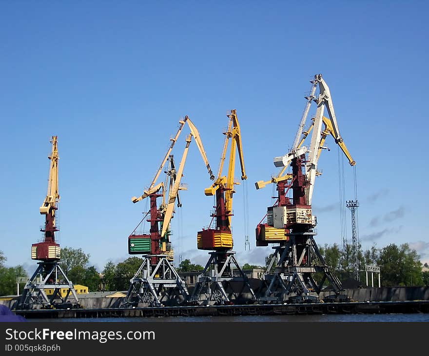 Lifting cranes in the port. Lifting cranes in the port.