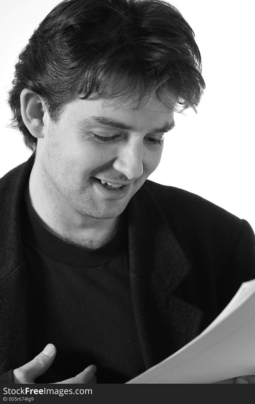 Young man reading a document (black and white). Young man reading a document (black and white)