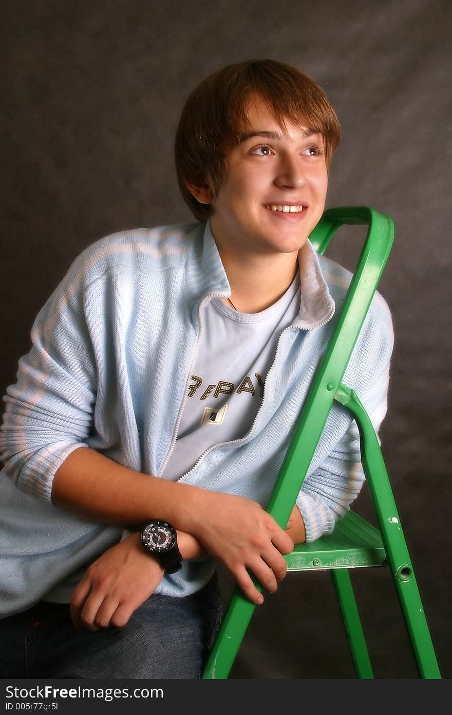 The young man with a green step-ladder