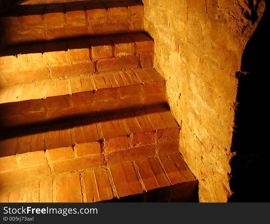 Stone stairs lit up in yellow.