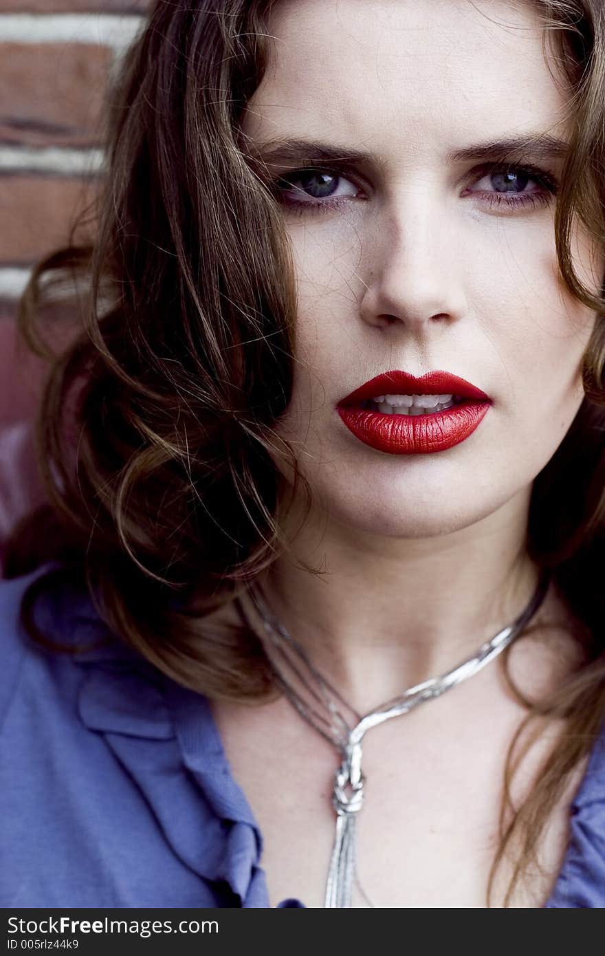 Close Up of a Beautiful Brunette Woman with Red Lips. Close Up of a Beautiful Brunette Woman with Red Lips