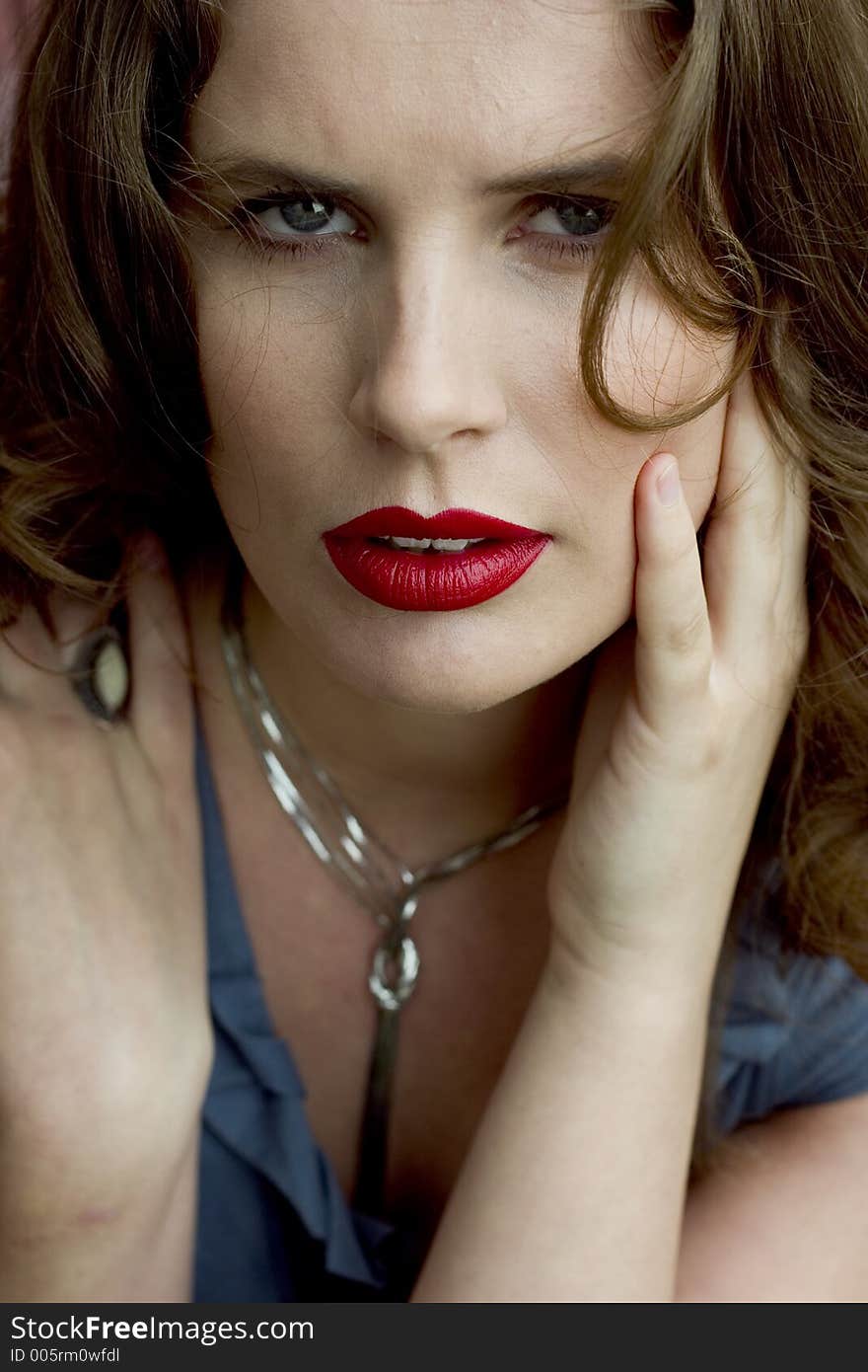 Close Up of a Beautiful Brunette Woman with Red Lips. Close Up of a Beautiful Brunette Woman with Red Lips