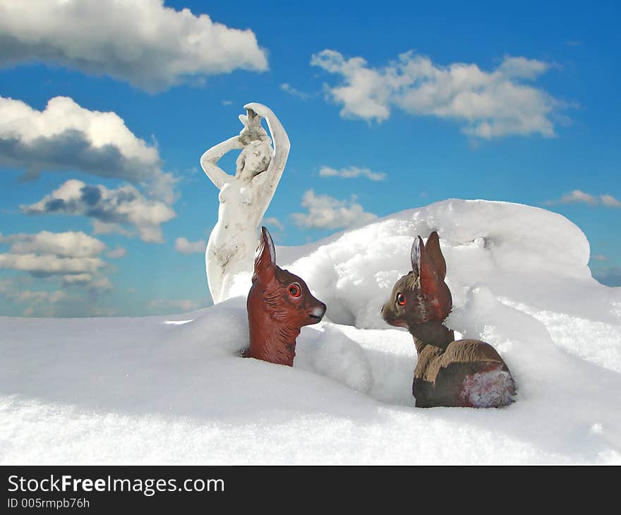 Strange Wintersituation with halfdigged sculpture and plastic deers. Strange Wintersituation with halfdigged sculpture and plastic deers