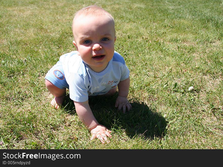 Boy Crawling in Grass