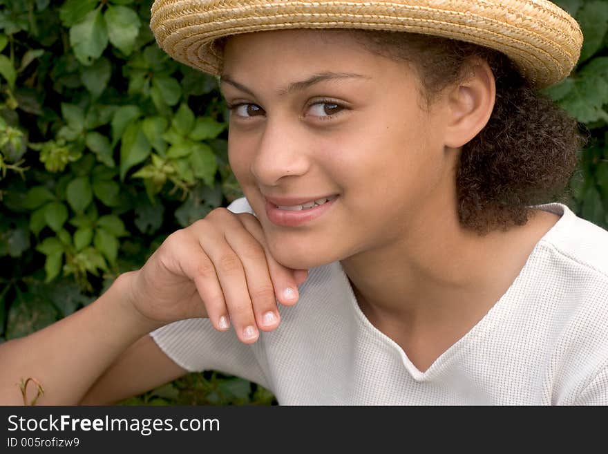 Girl posing with her summer hat. Girl posing with her summer hat