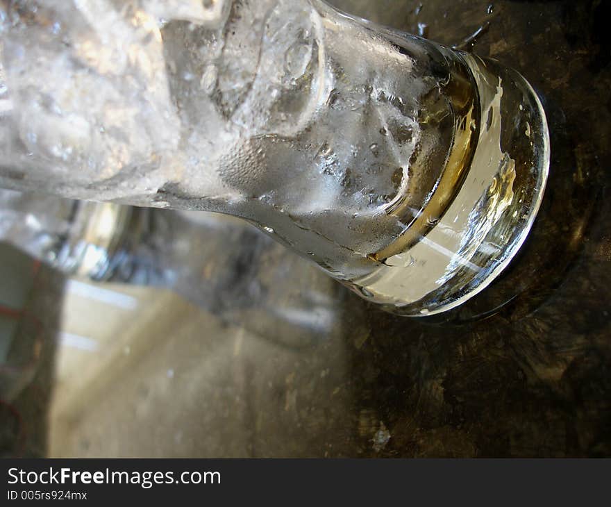 Two glasses of same drink side view. Two glasses of same drink side view