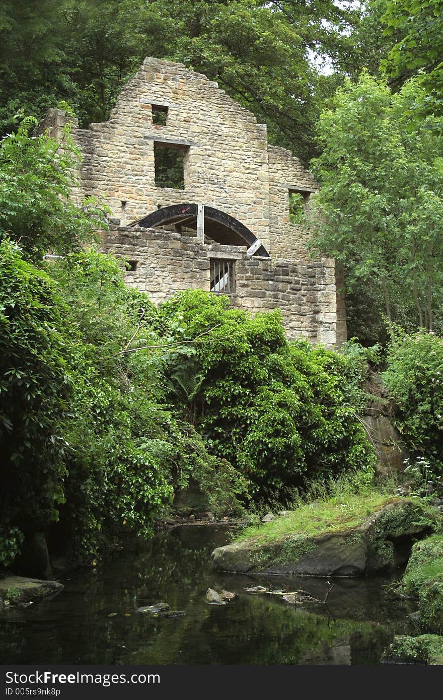 Old disused water mill in a dene in Jesmond, Northumberland, England